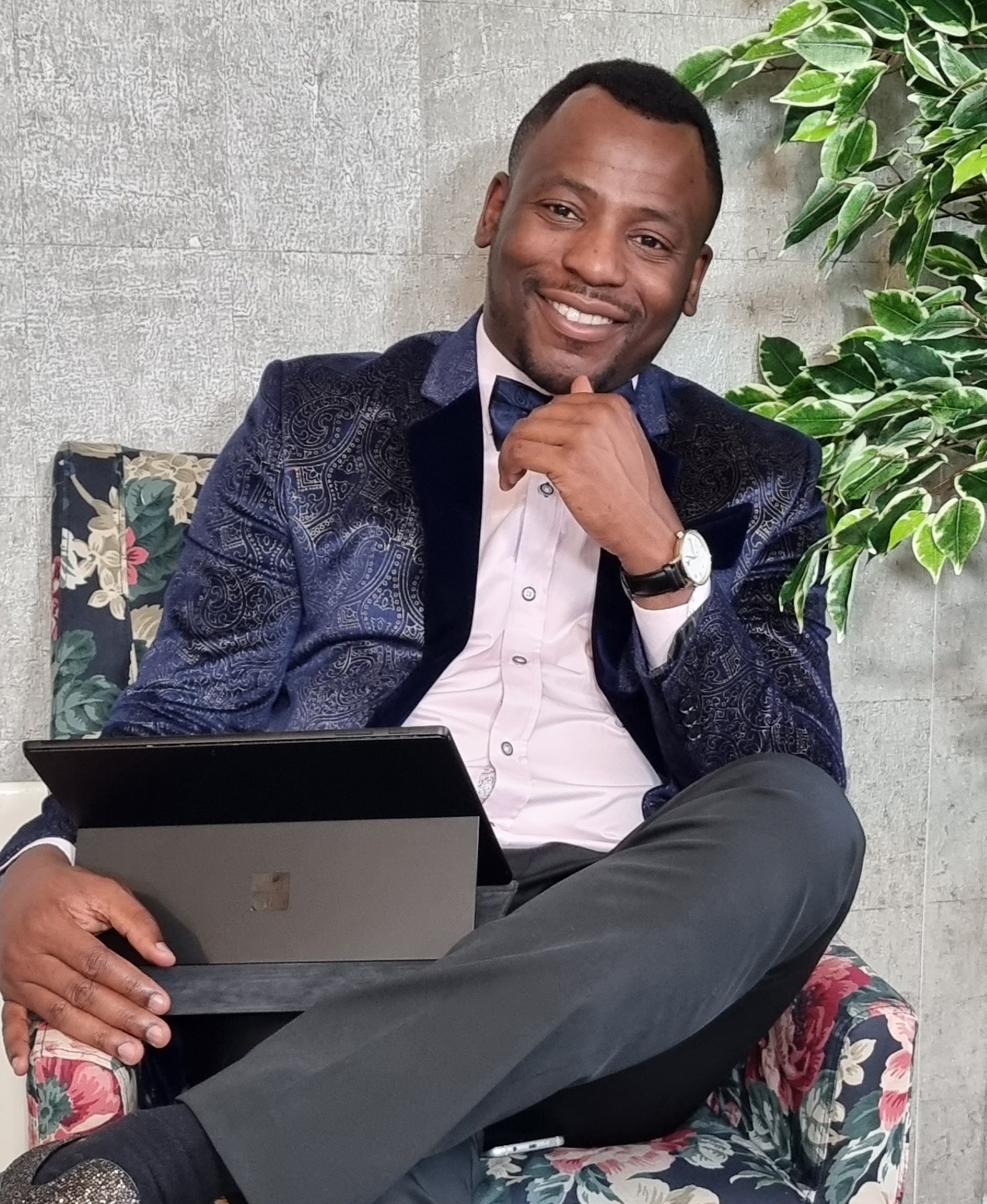 Gabriel Topman seated with a laptop